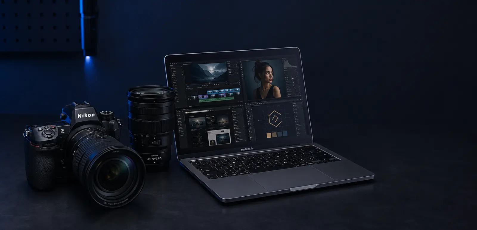 Câmera Nikon, lentes e MacBook Pro com edição de vídeo, fotografia, sites e identidade visual na tela
